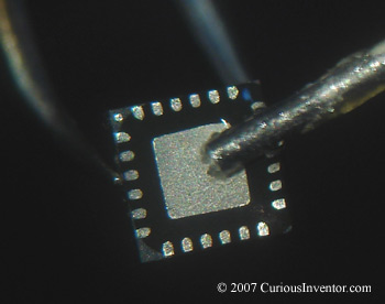 Adding flux to the bottom of a clean QFN chip
